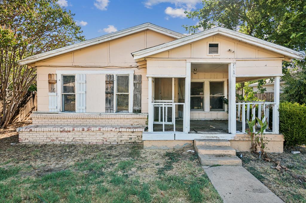 front view of a house with a yard