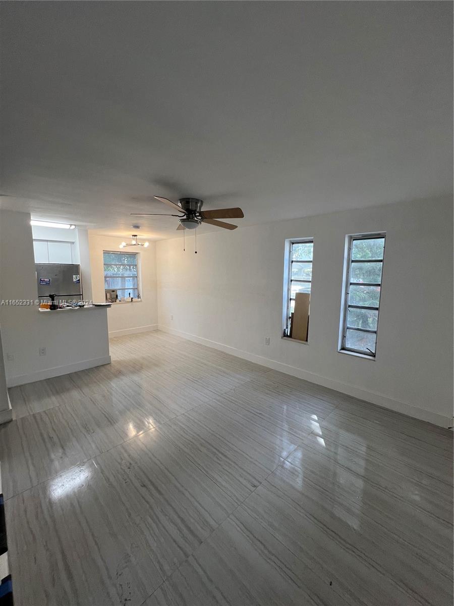 a view of a livingroom with wooden floor