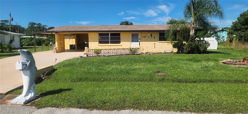 a front view of house with yard and green space