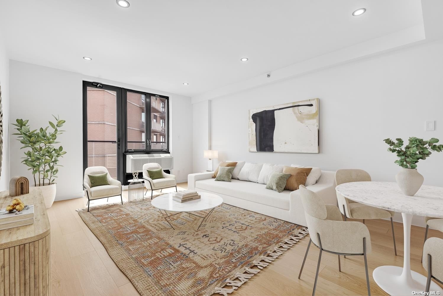 a living room with furniture and a potted plant