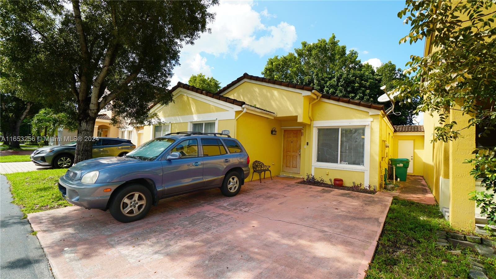 a car parked in front of a house