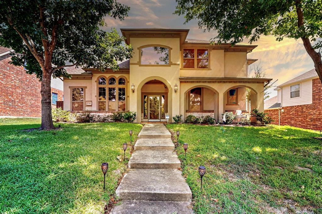 front view of a house with a garden