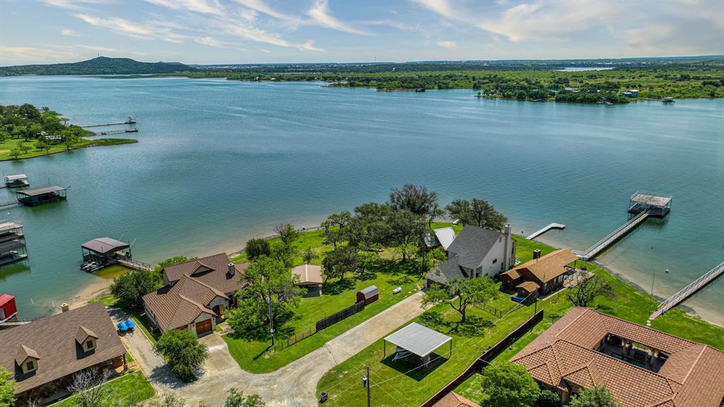 an aerial view of a houses with ocean view