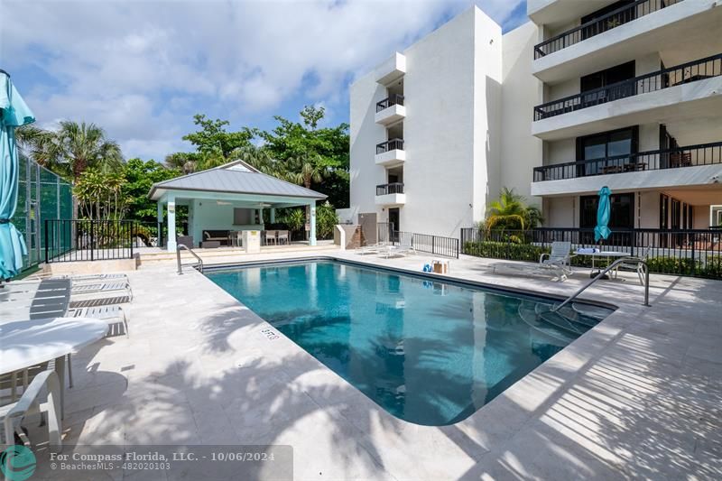 a view of a swimming pool with a patio