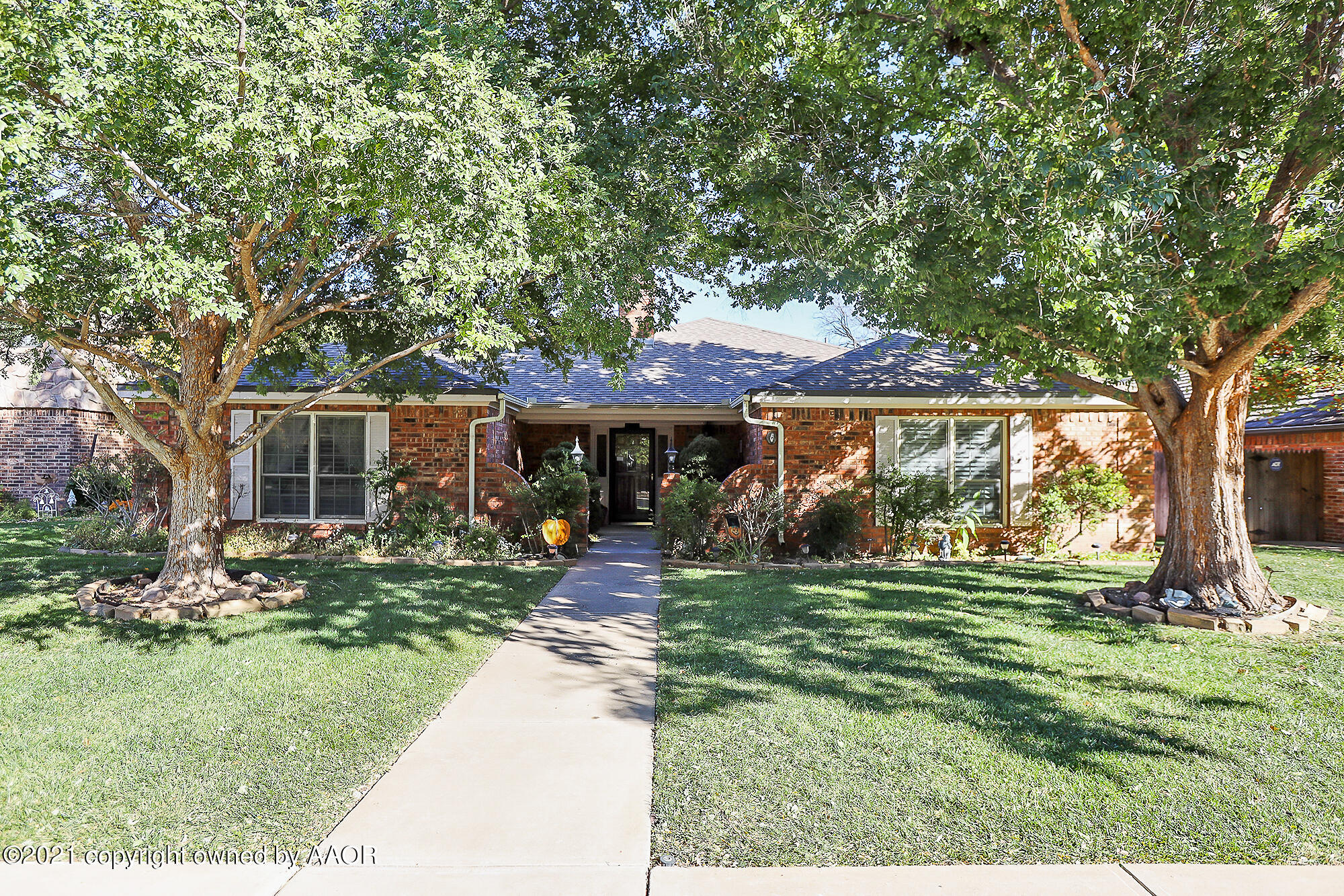 front view of a house with a yard