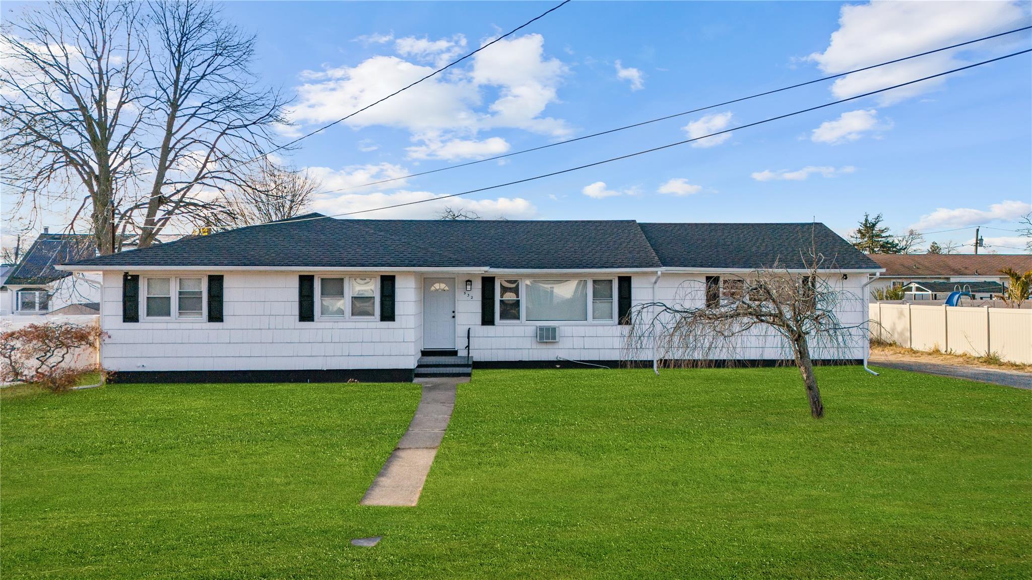 Ranch-style home with a front yard