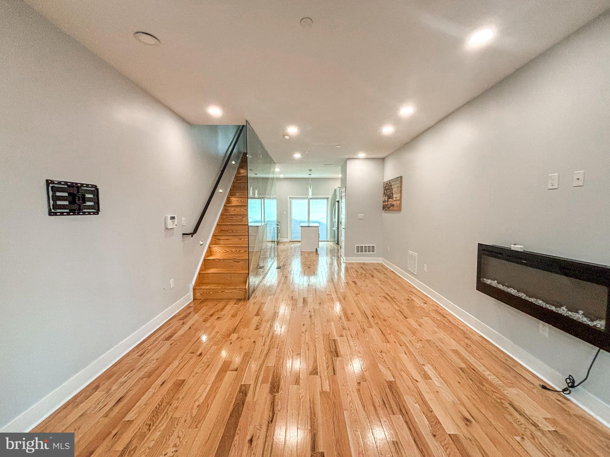 a view of entryway with wooden floor