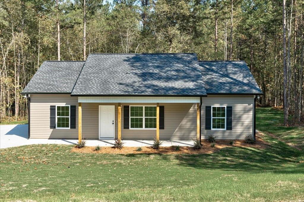 front view of a house with a yard