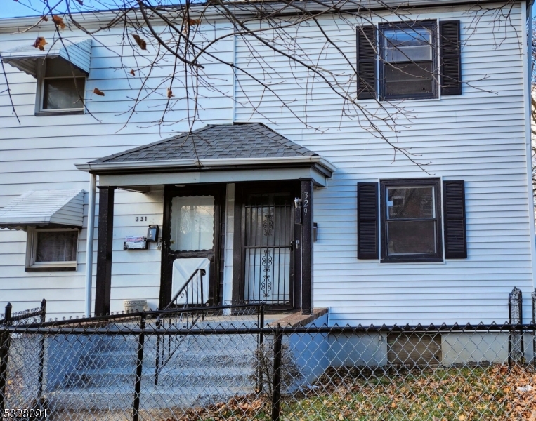 a front view of a house with stairs