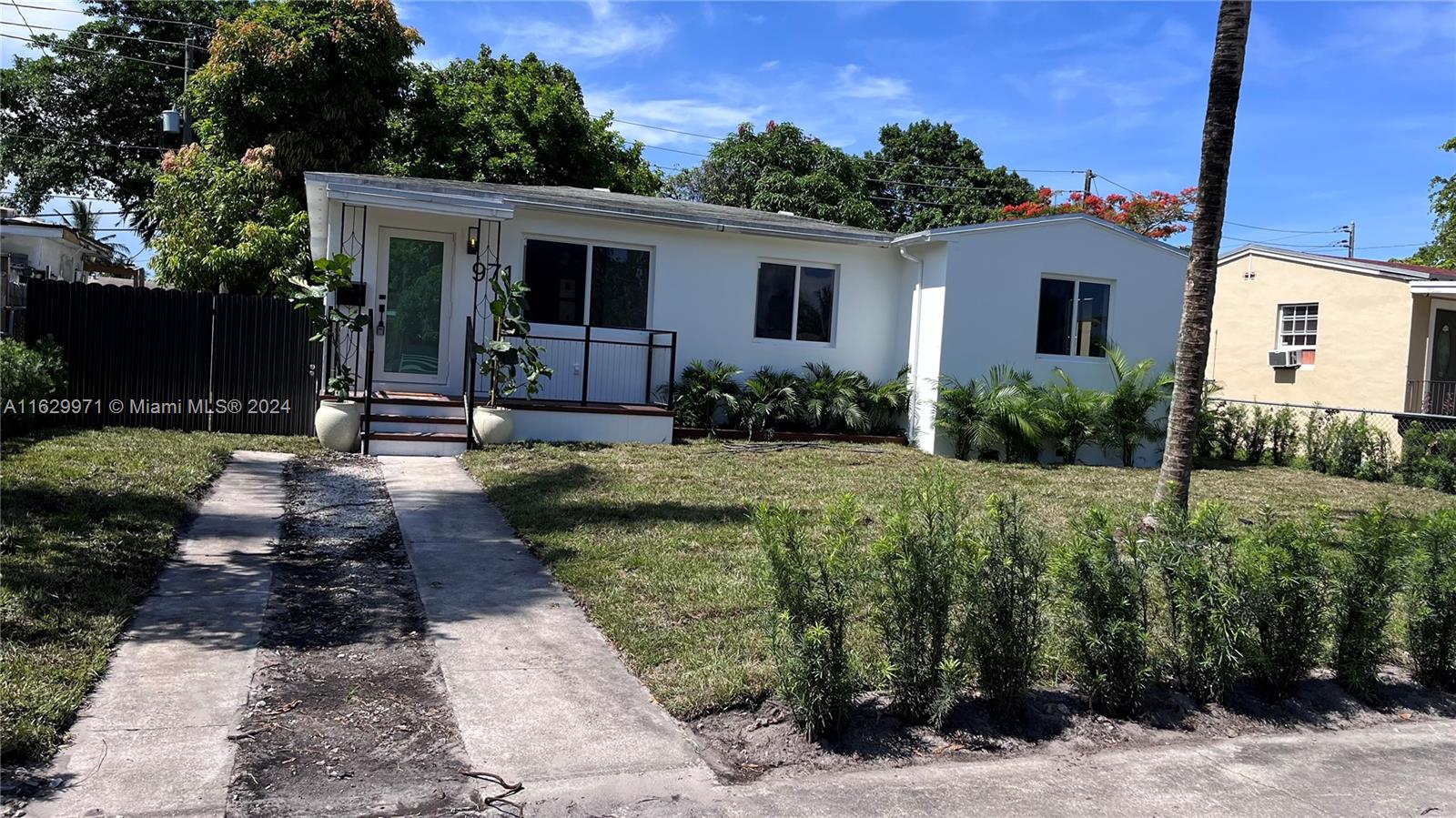 a front view of a house with garden