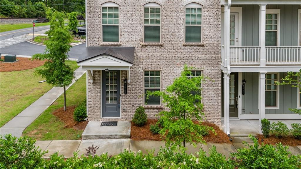 a front view of a house with garden