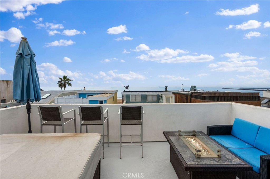 a view of a terrace with furniture and a flat screen tv