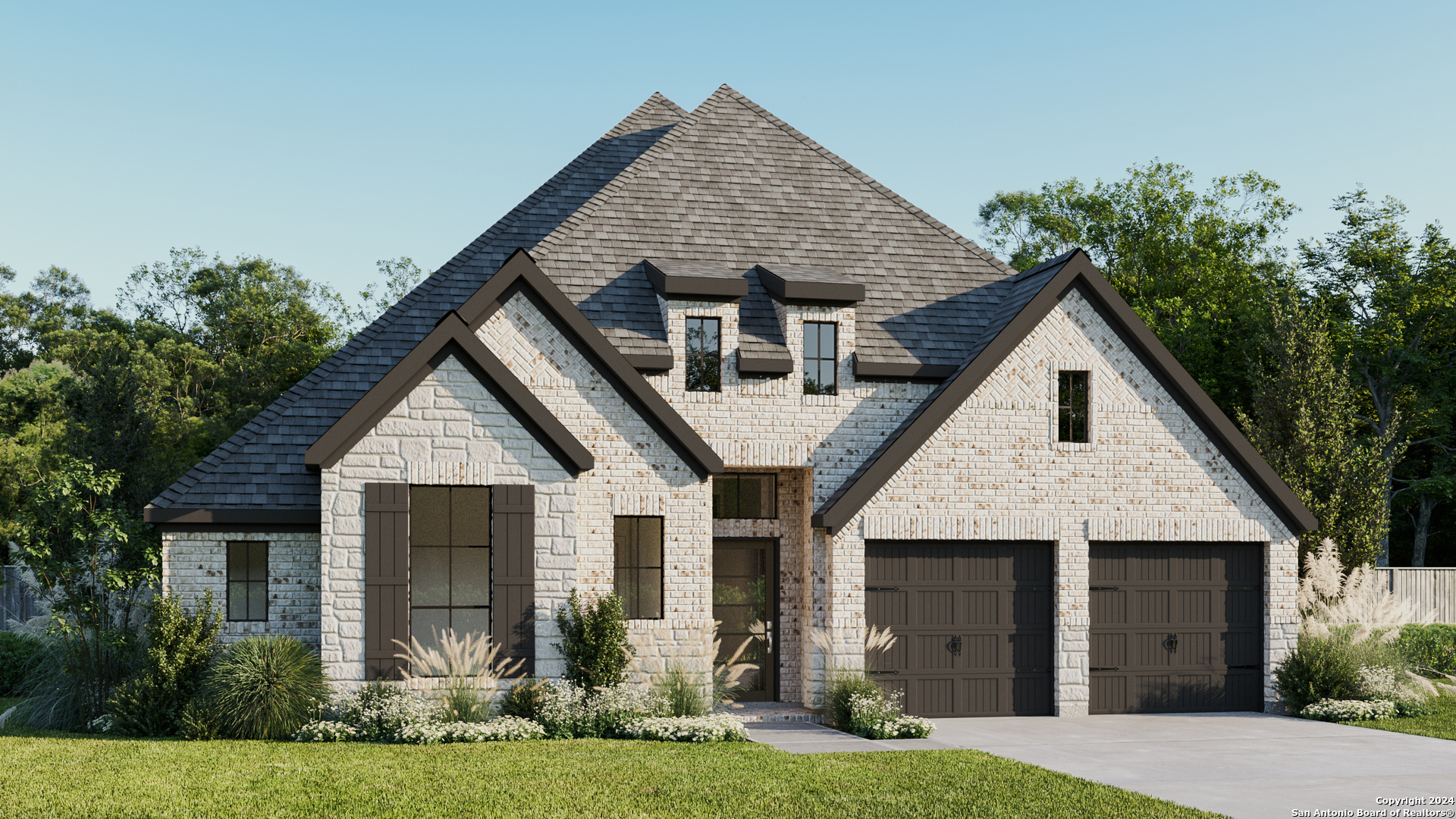 a front view of a house with a yard and garage