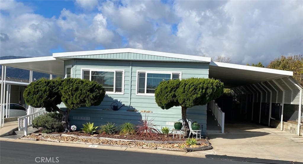 a front view of a house with garden