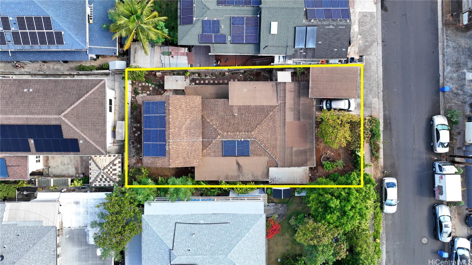 an aerial view of a house with a yard and a garage