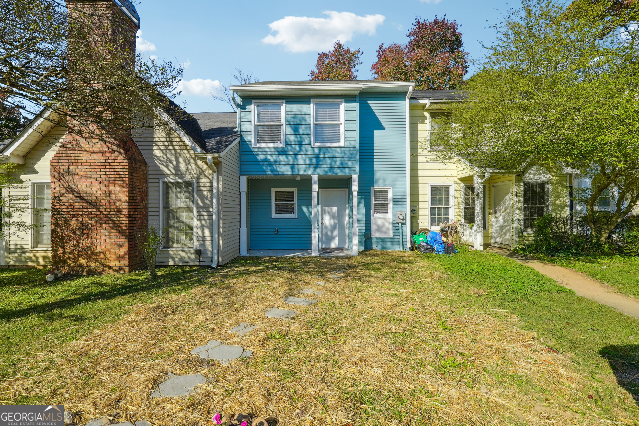 a front view of a house with a yard