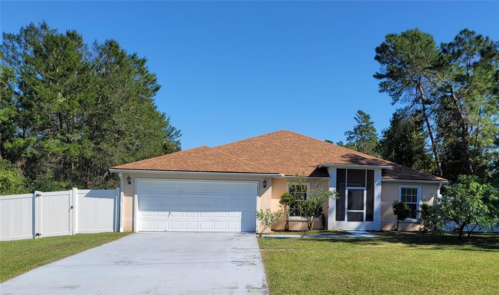 a front view of a house with a yard and porch