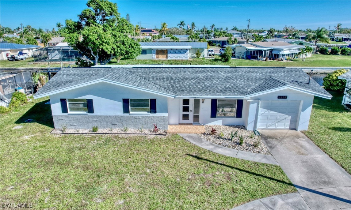 a aerial view of a house with a yard