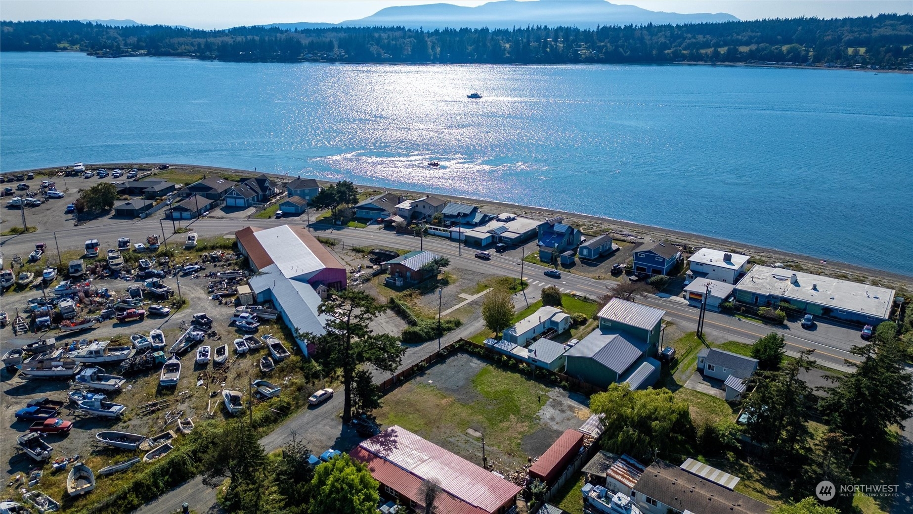 an aerial view of a house with a lake view