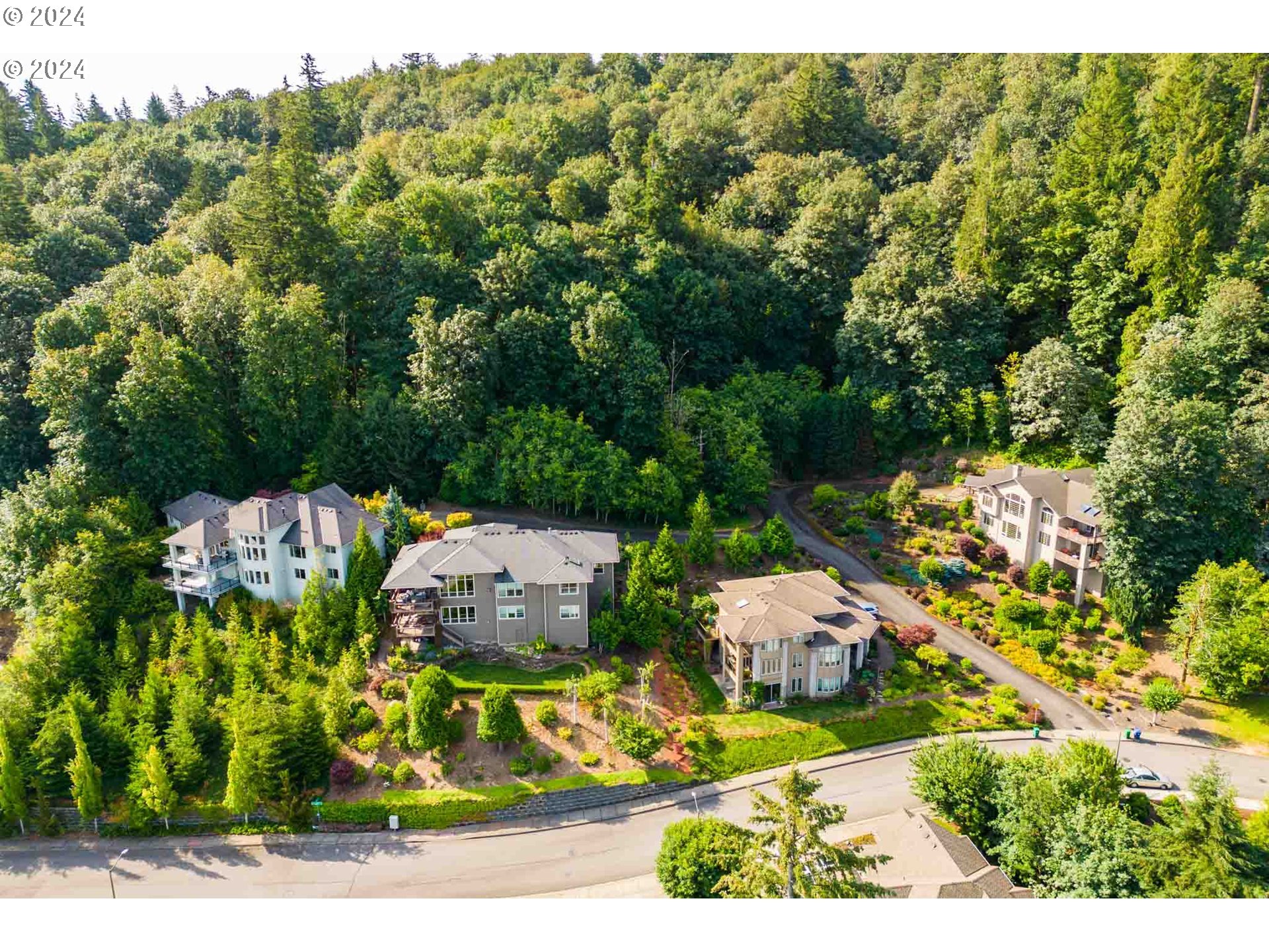 an aerial view of a house with a yard basket ball court and outdoor seating