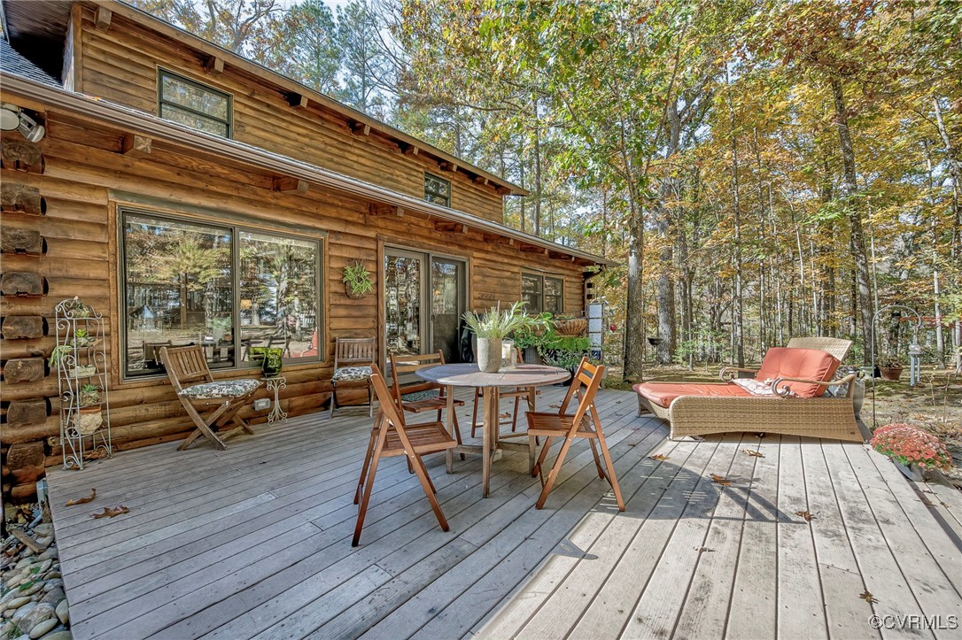 a view of a two chairs and table on the wooden floor