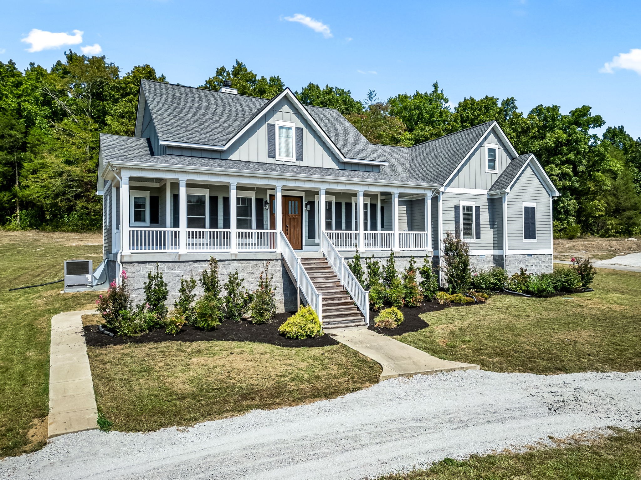 front view of a house with a yard