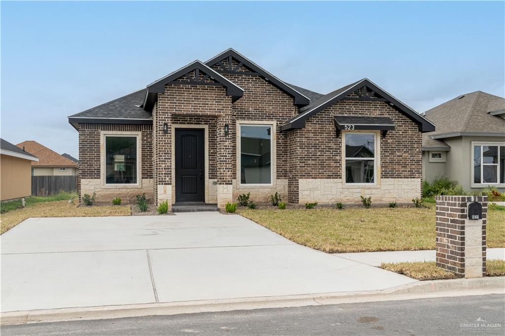 a front view of a house with yard