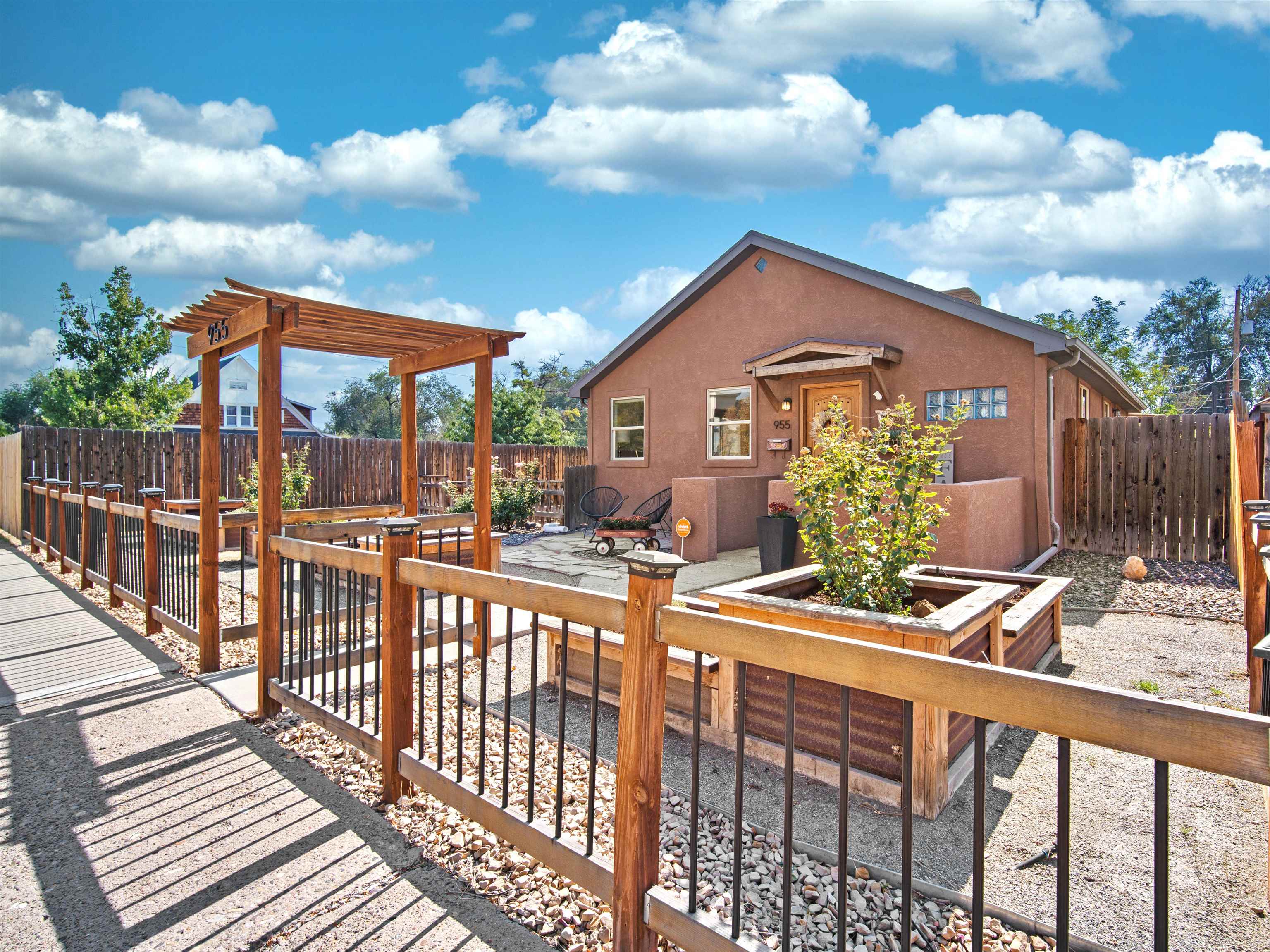 a view of a house with a yard and wooden floor