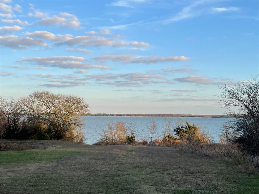 a view of a lake with a big yard