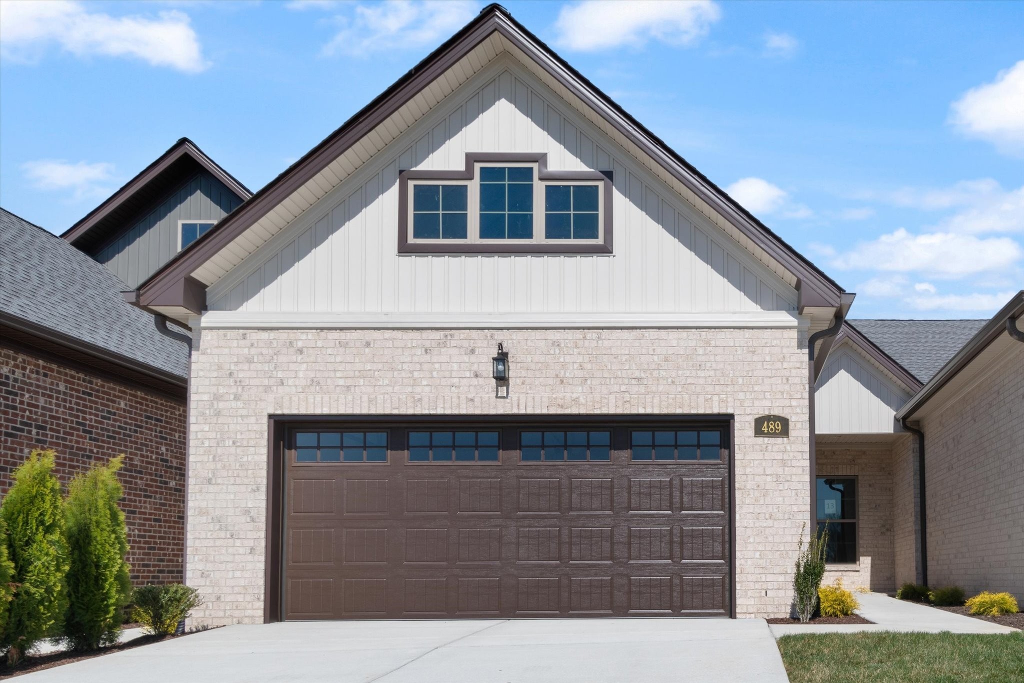 a front view of a house with garage