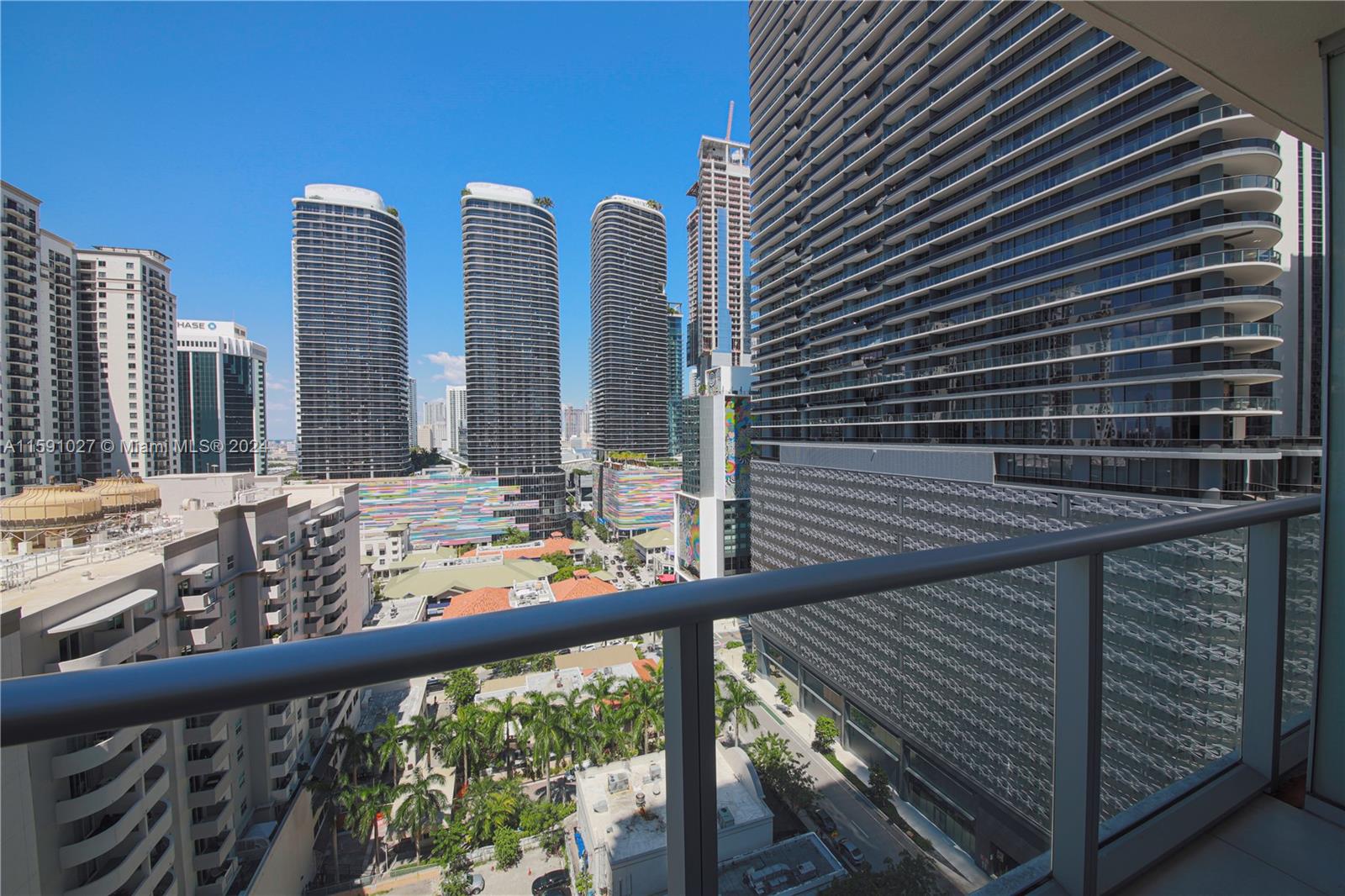 a view of a balcony with wooden floor and fence