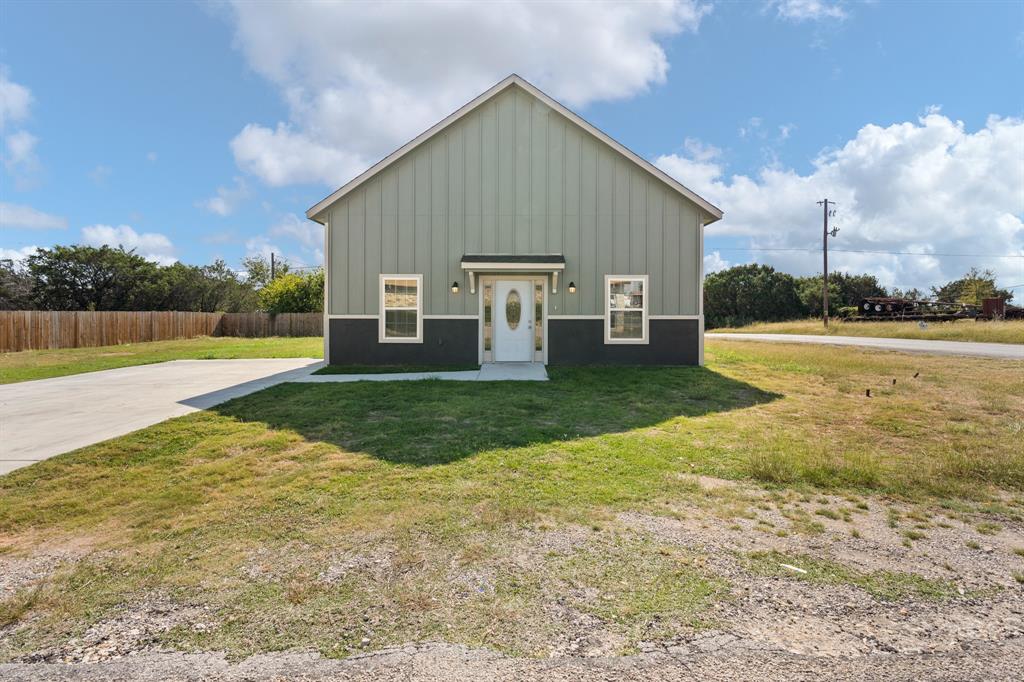 a view of a house with a big yard