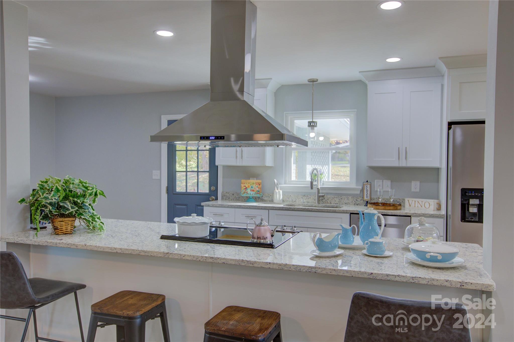 a kitchen with counter space cabinets and appliances