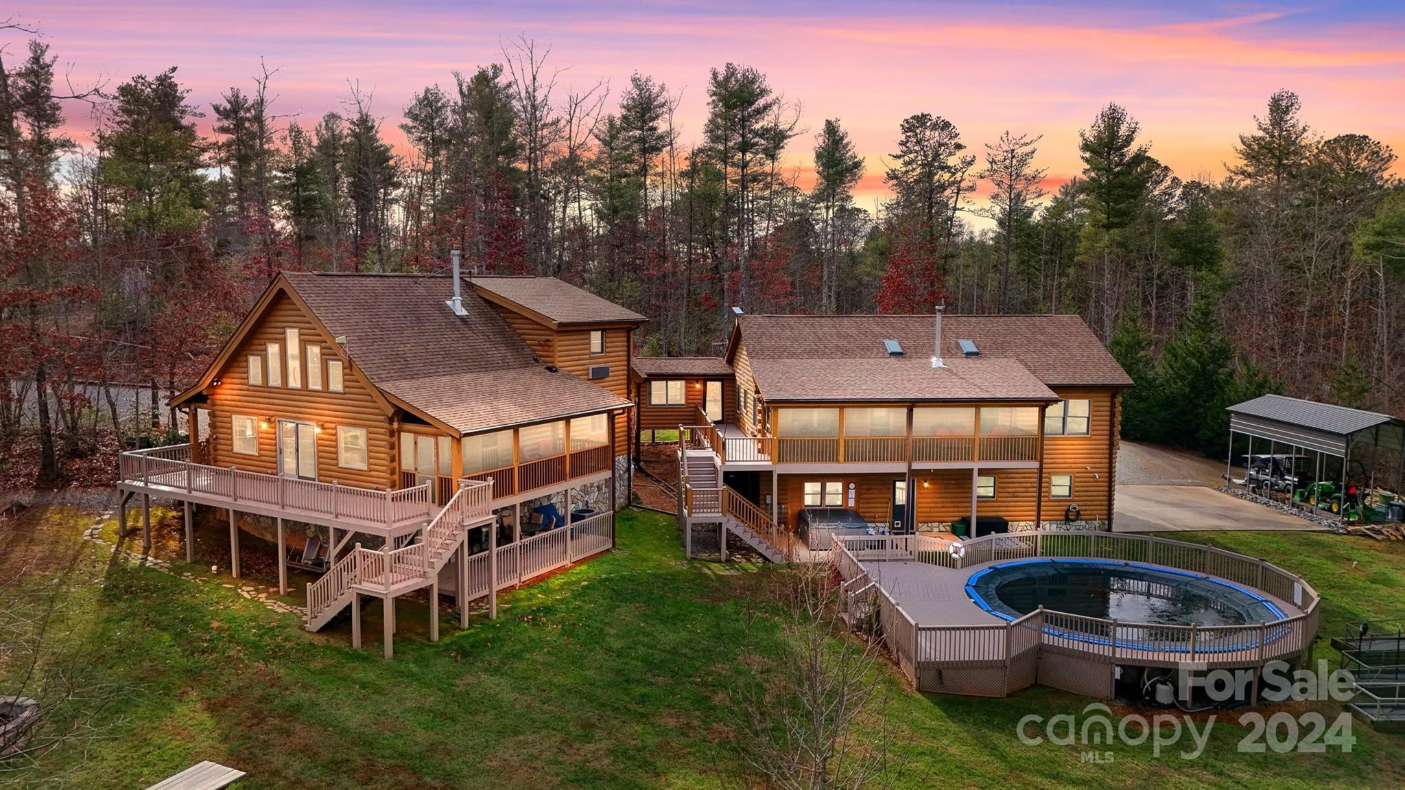 a aerial view of a house with swimming pool and a yard