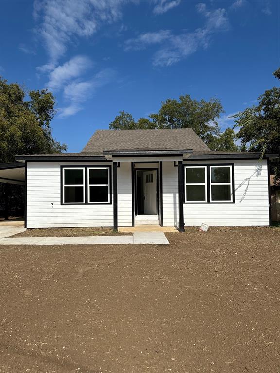 front view of a house with a yard