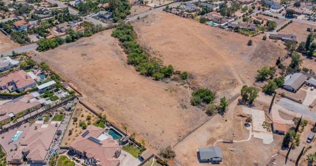 an aerial view of house with a yard