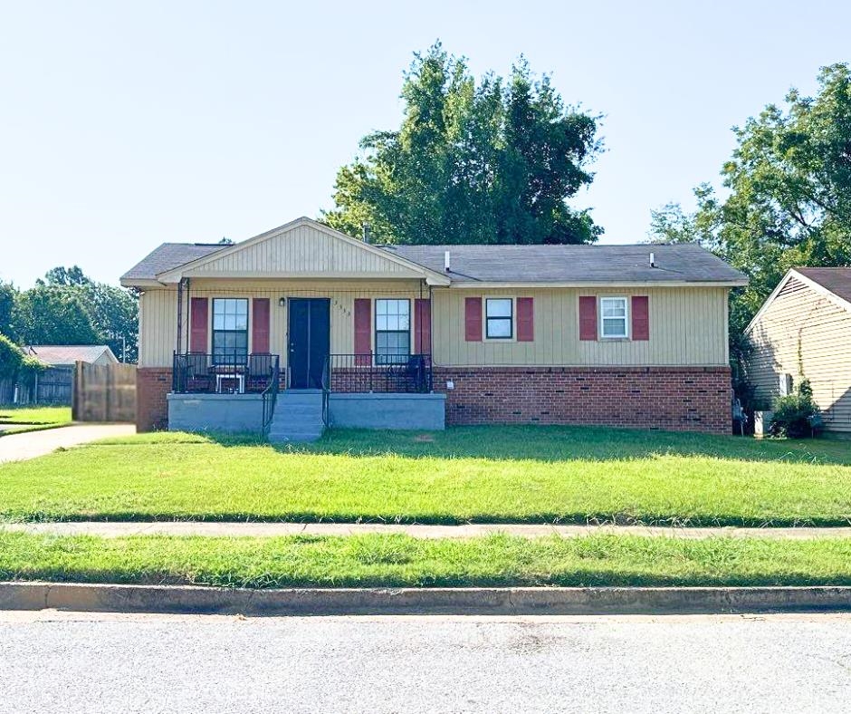 a front view of a house with a yard