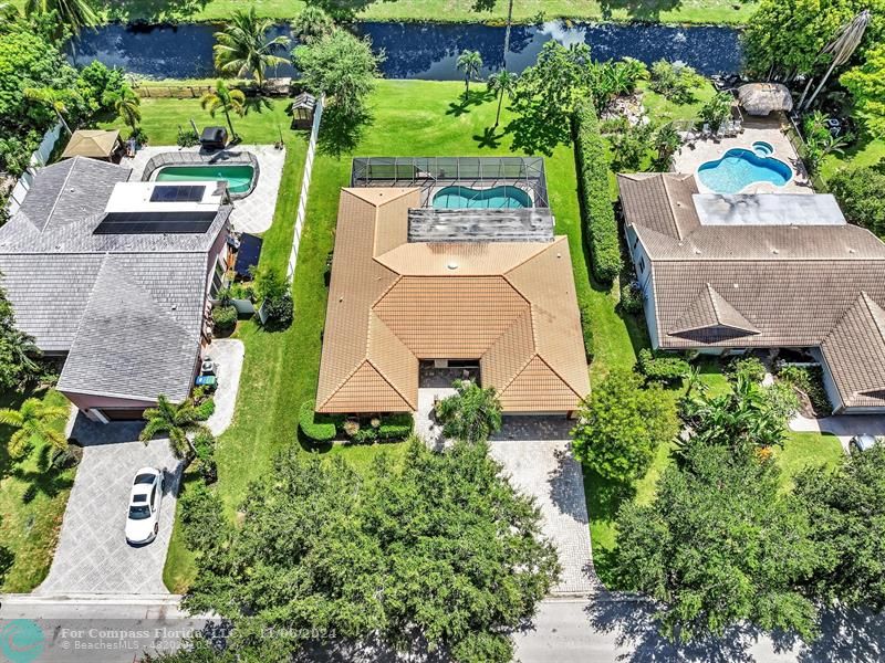 an aerial view of a house with outdoor space