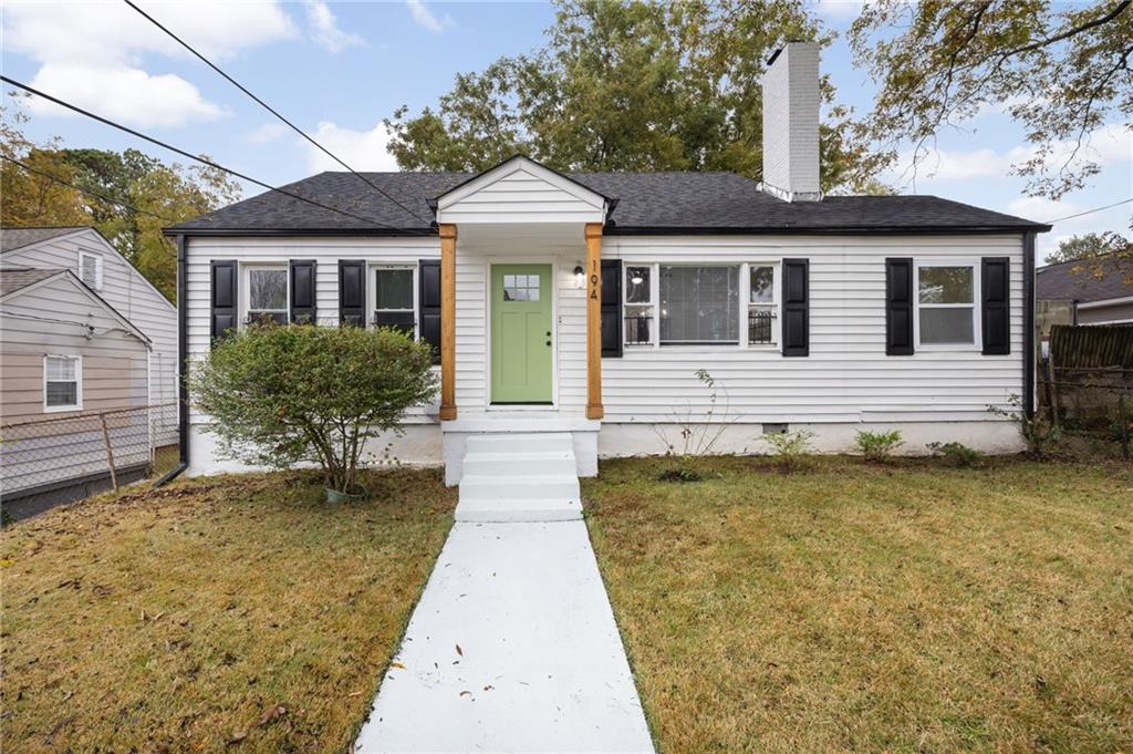 a front view of a house with yard