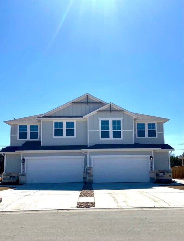 a front view of a house with yard