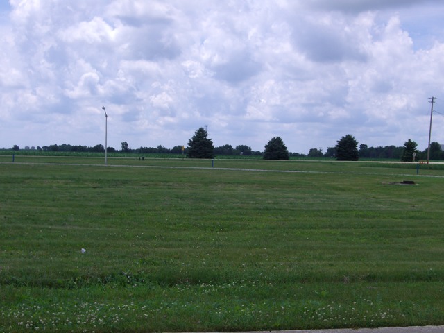 a front view of a lake and a houses