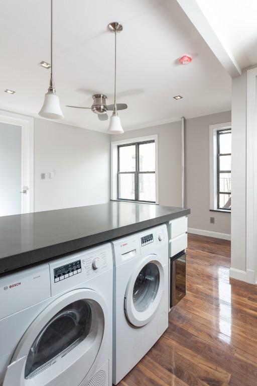 a view of a kitchen with washer and dryer