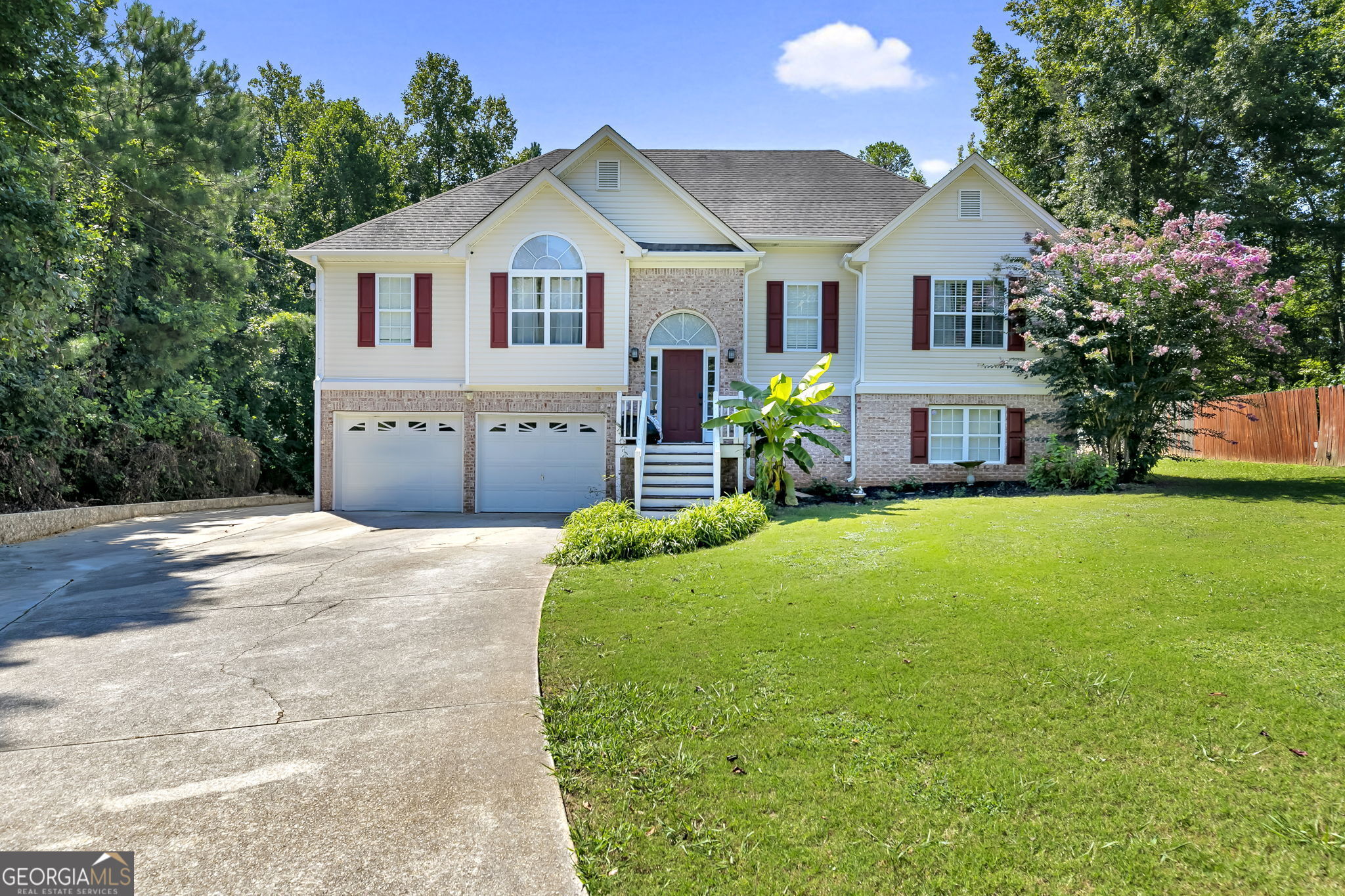 a front view of a house with garden