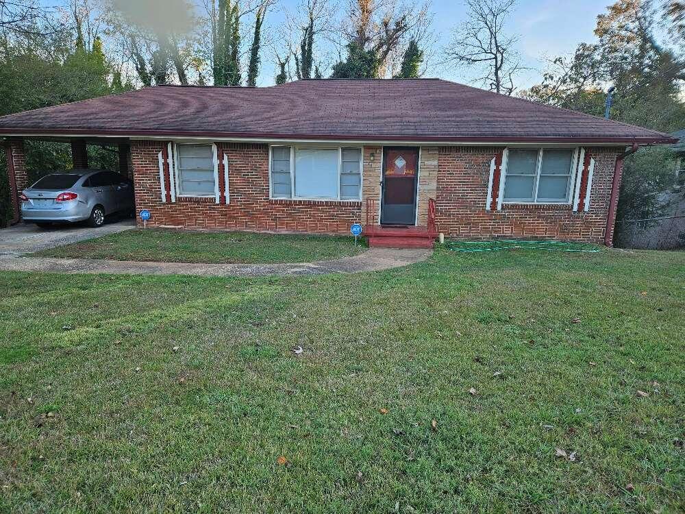 a view of a house with a backyard