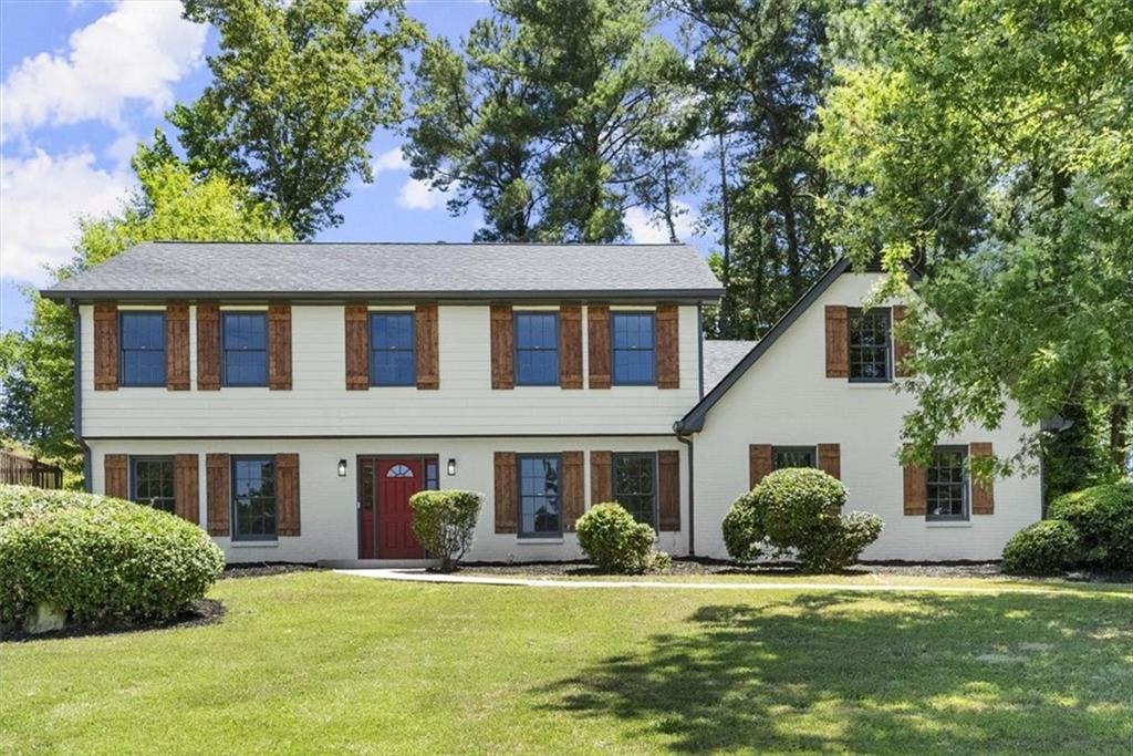 a front view of a house with a yard