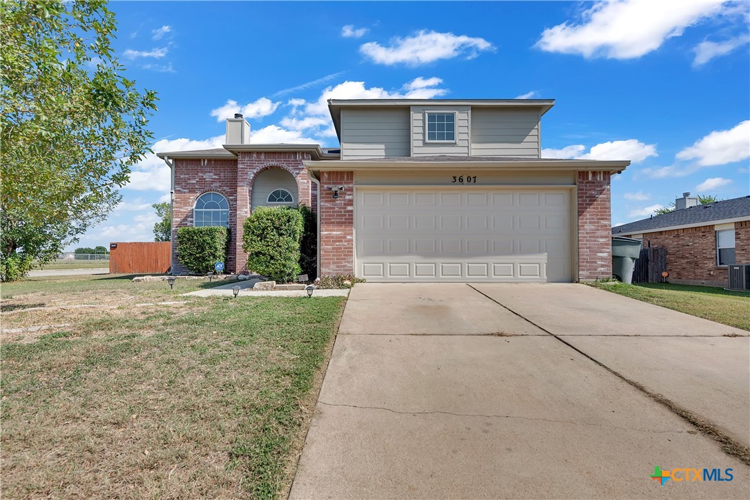 a front view of a house with yard