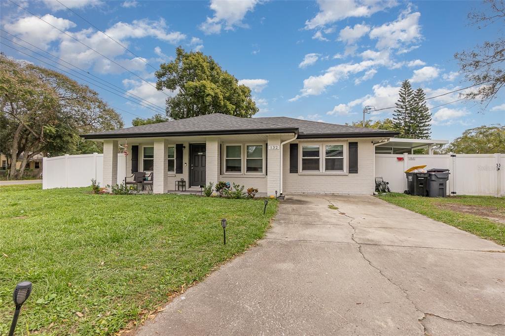 front view of a house with a yard