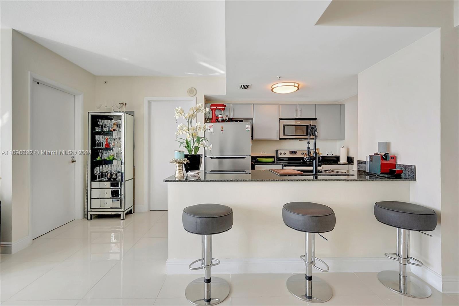 a kitchen with a dining table and chairs