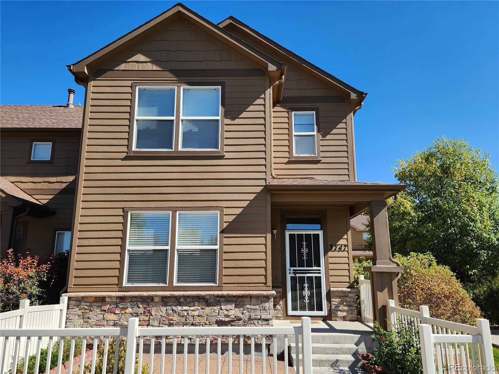 a front view of a house with a porch