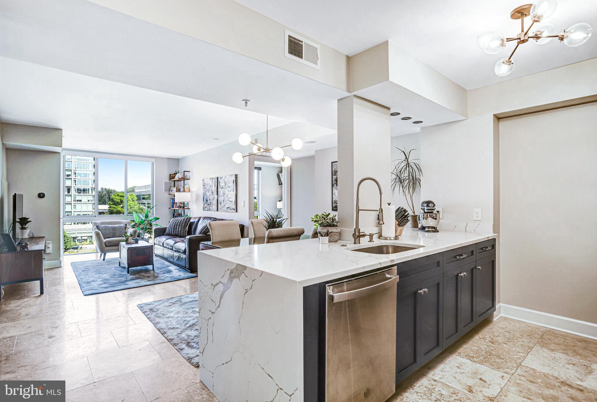 a view of a kitchen counter top space and living room